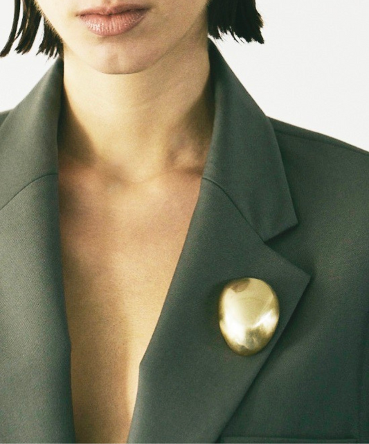 Egg sculpture brooch